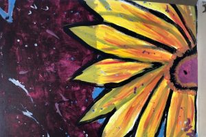 Gayle's sunflower painting is on the cover of 2018 Annual Report